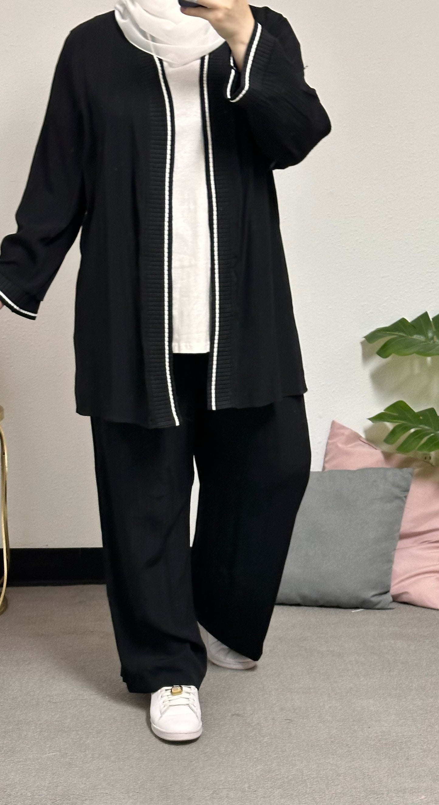“Three-piece set including a short cardigan, inner blouse, and pants.”